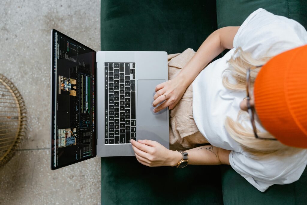 editor editing video on laptop