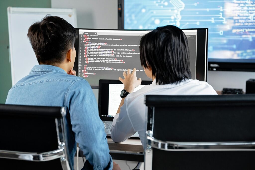 tow web developer analyzing codes and computer language