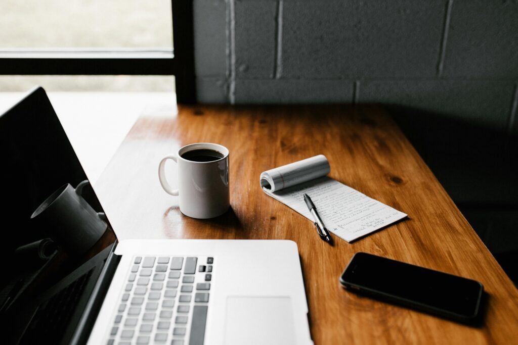laptop mobile notepad and coffee cup
