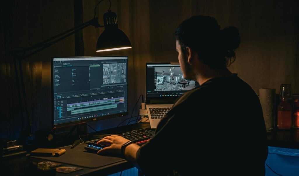 editor editing video on computer and laptop 