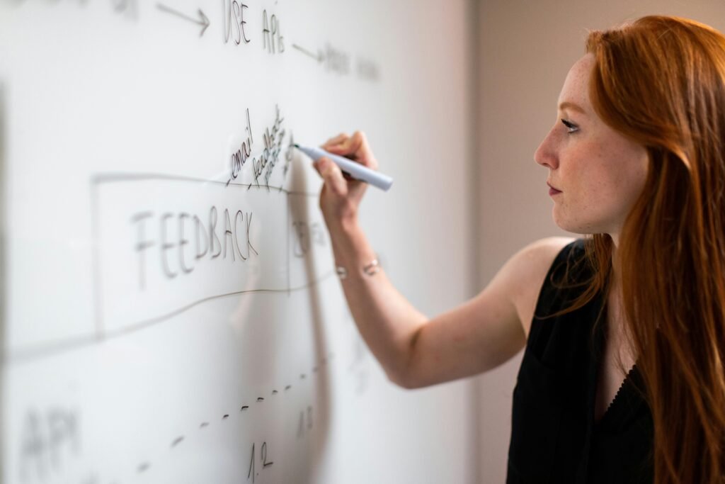 SEO consultant drawing a road map on white board